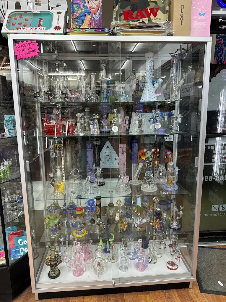 Premium glass showcase with dab rigs and bongs at Cloud Factory